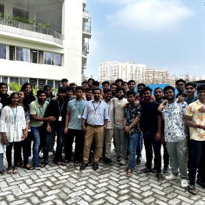 Dr. Dhanoj Gupta with students outside Pearl Research Park